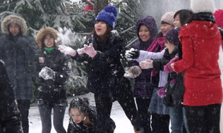 Students having fun in the snow at the Richard Language College site